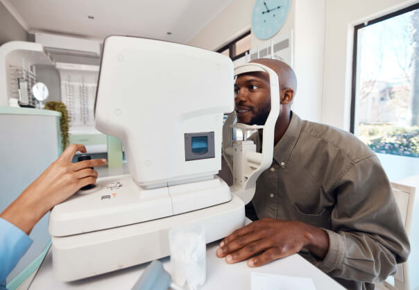 Man getting a contact lens exam at Advanced Eyecare and Vintage Eyewear