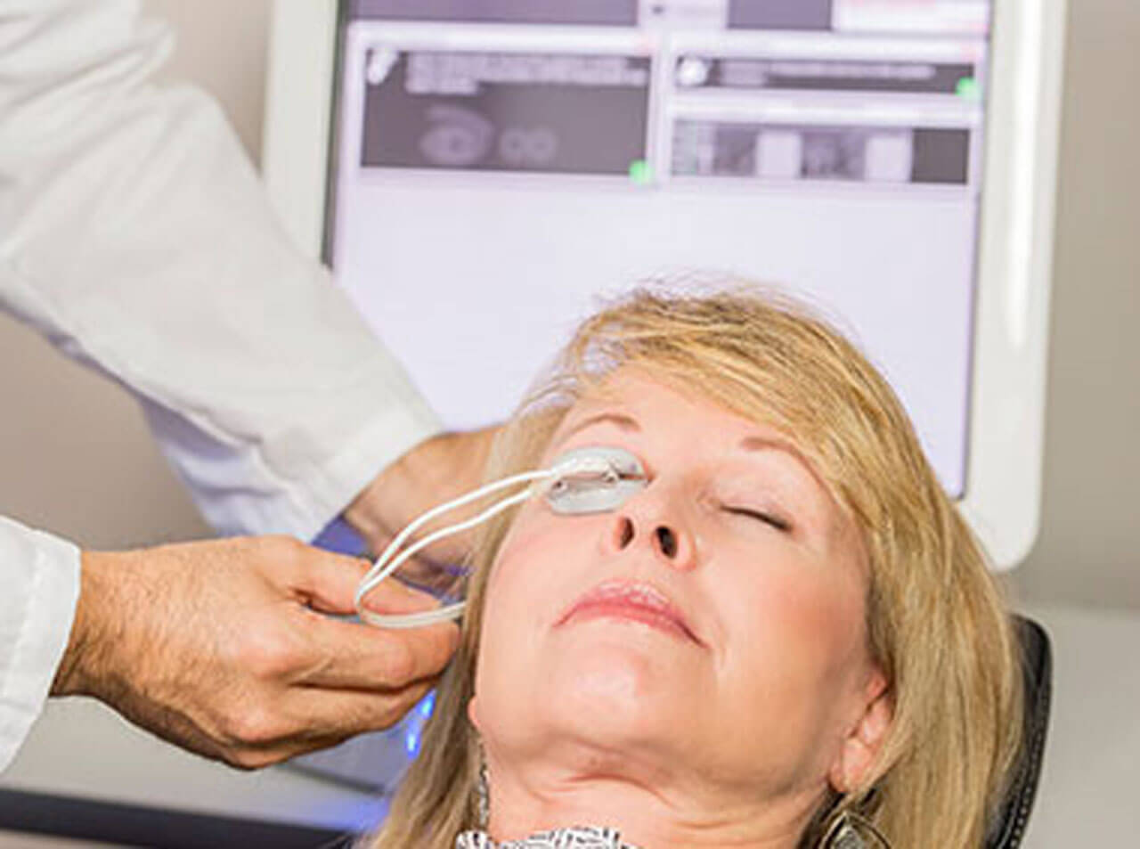 Woman undergoing lipiflow treatment