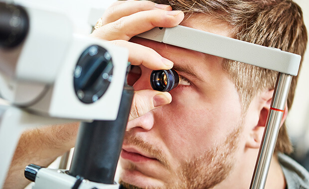 Man undergoing eye exam at Abilene, TX