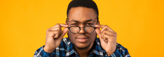 Man wearing glasses for astigmatism