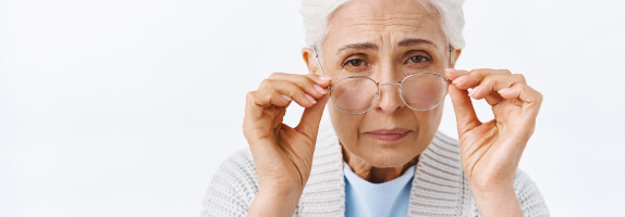 Woman with AMD wearing glasses