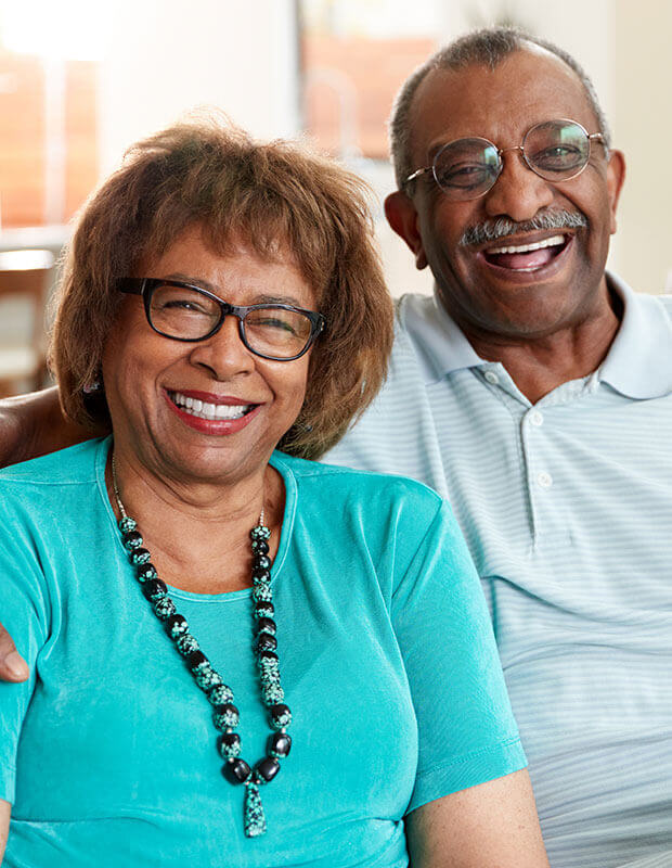 Smiling couple wearing glasses